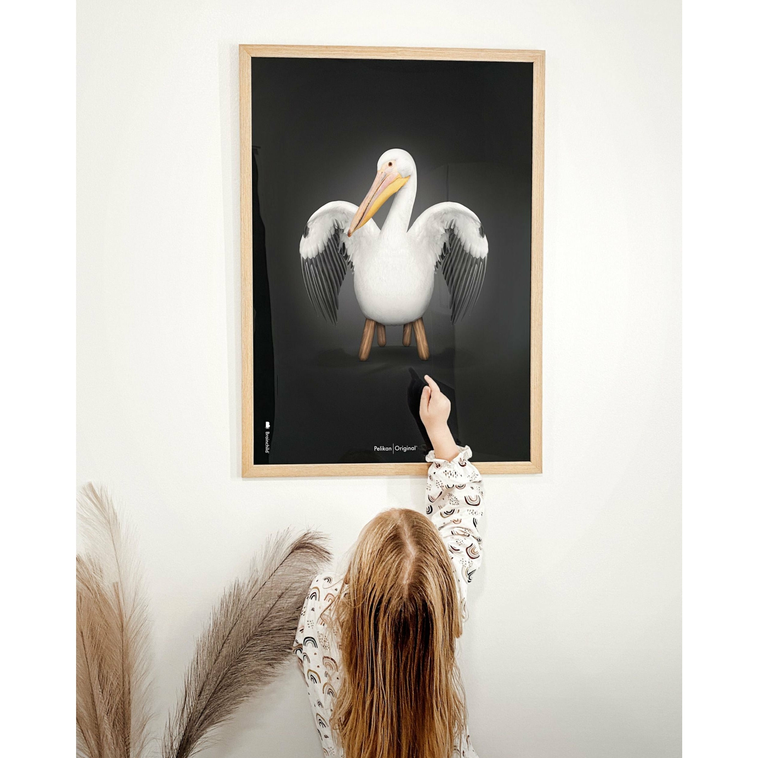 Brainchild Pelikan Classic Poster, Frame Made Of Light Wood 70x100 Cm, Black Background