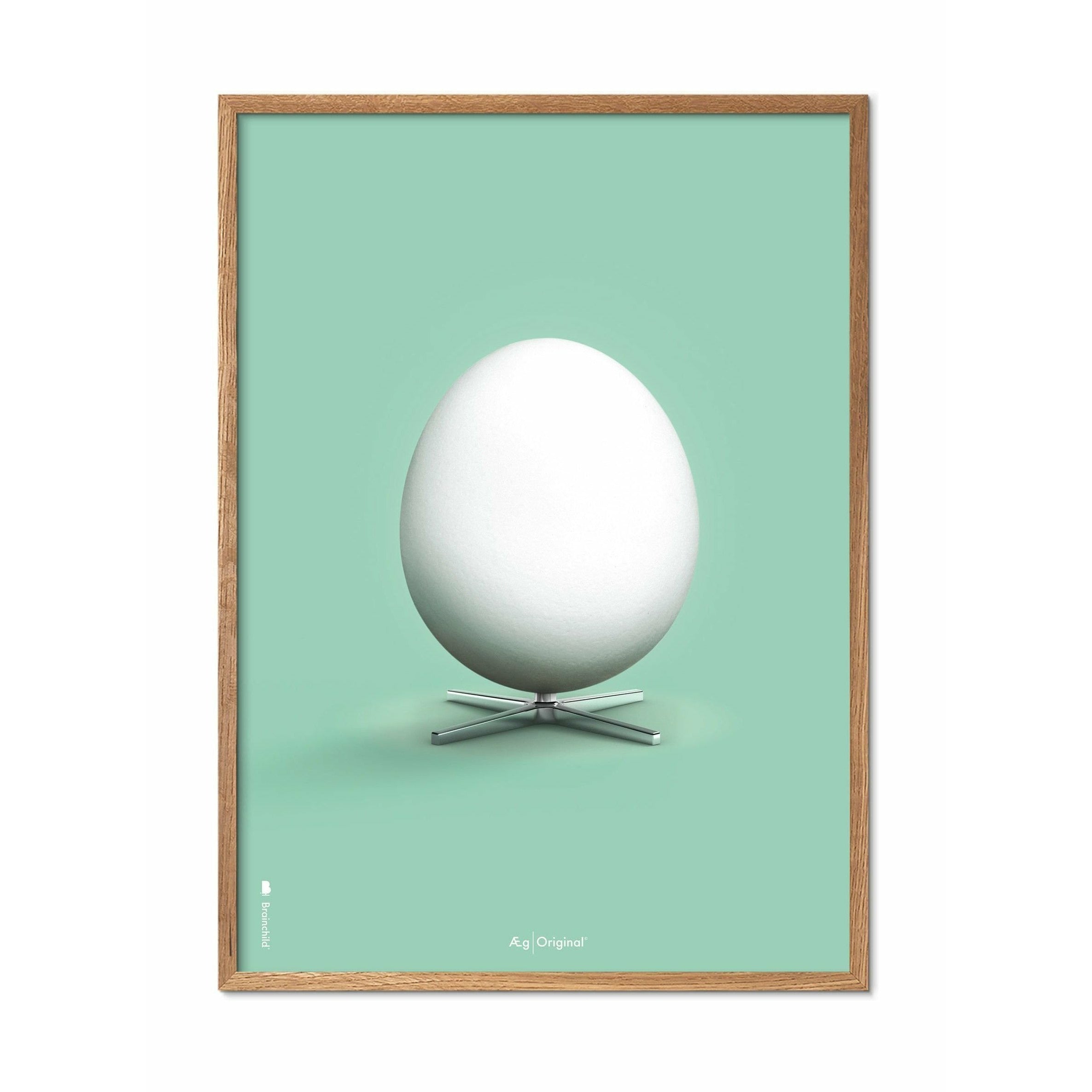 Brainchild Egg Classic Poster, Frame Made Of Light Wood 50x70 Cm, Mint Green Background