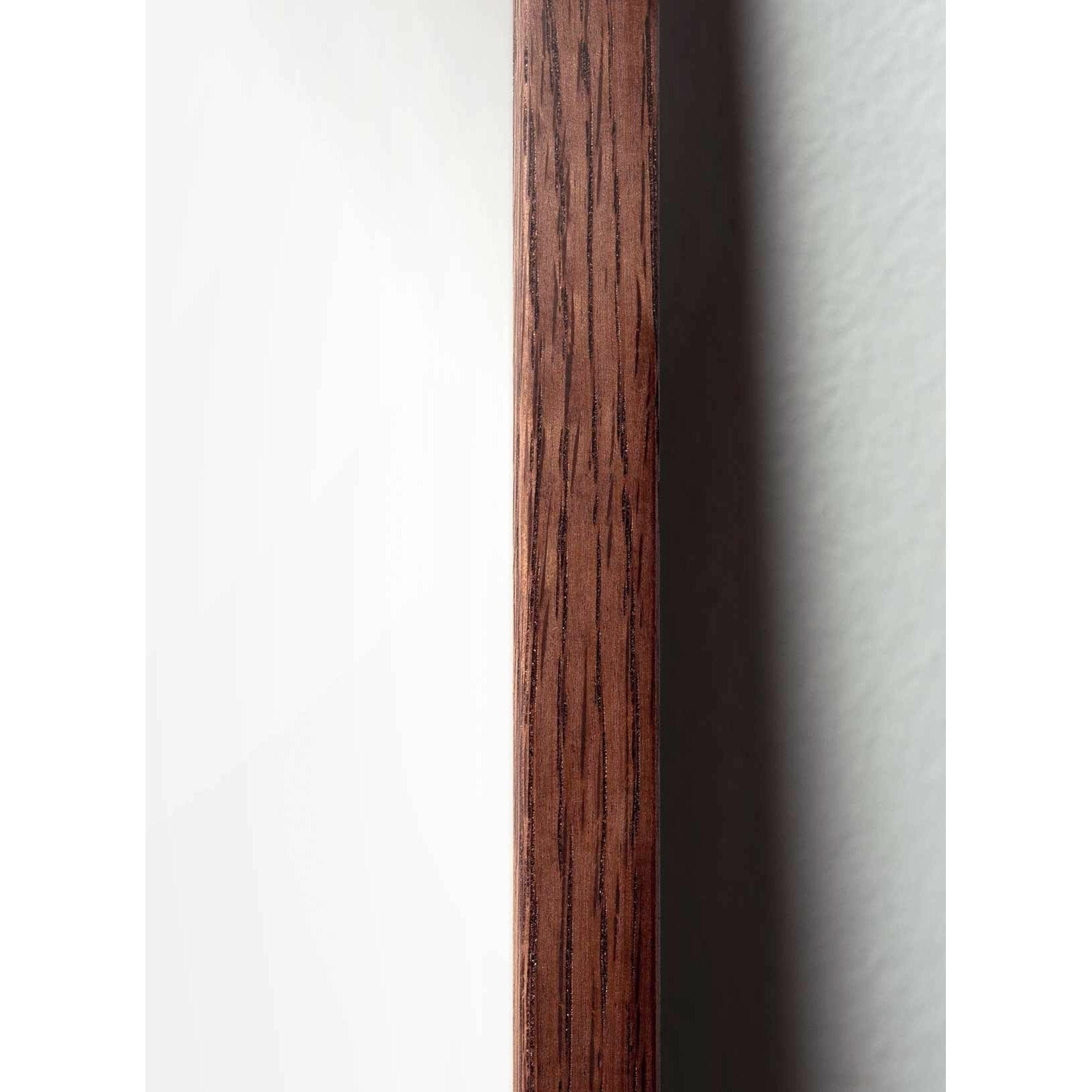 Poster classico di cono di pino da un'idea, cornice in legno scuro A5, sfondo colorato di sabbia