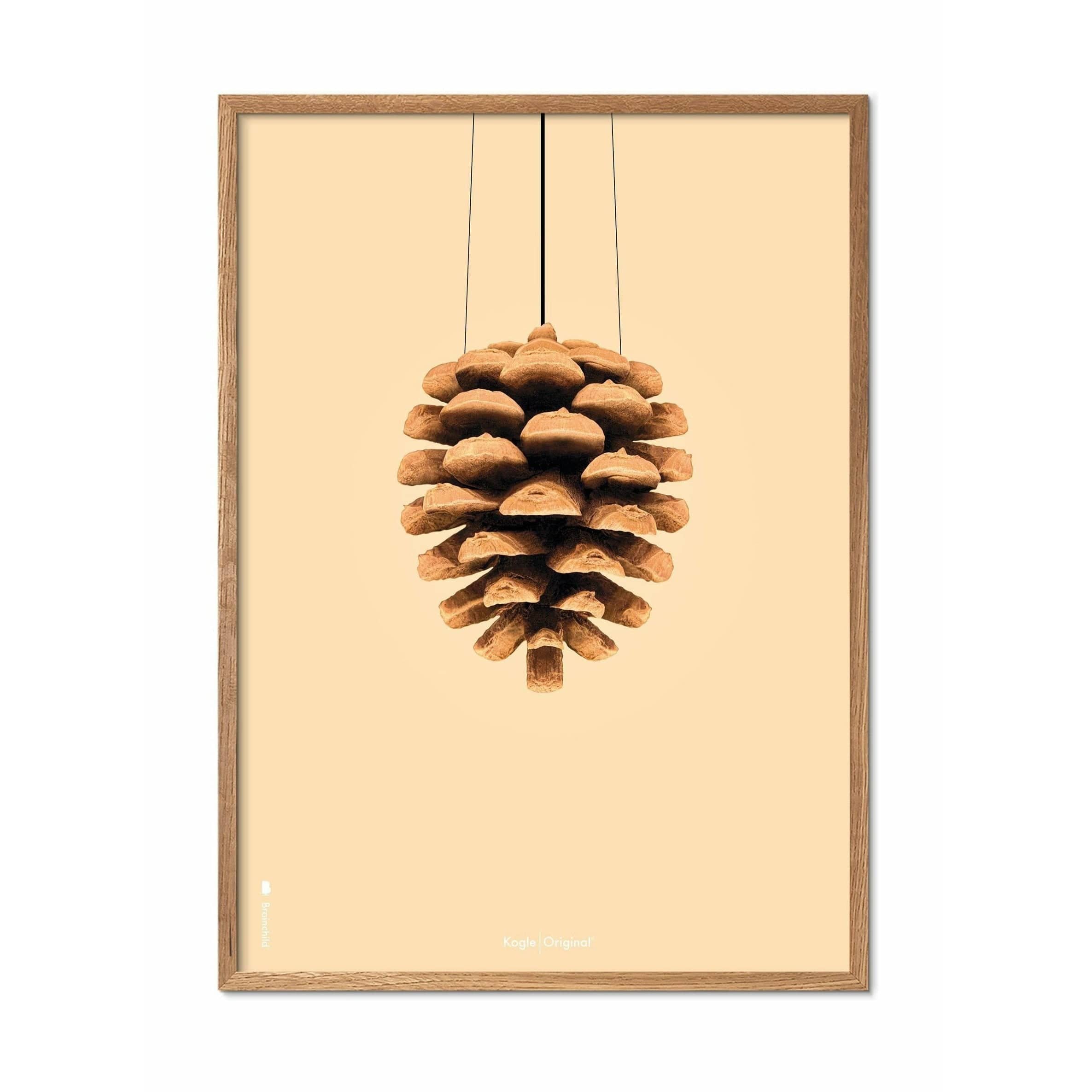 Brainchild Pine Cone Classic Poster, Frame Made of Light Wood 70x100 cm, sandfarget bakgrunn