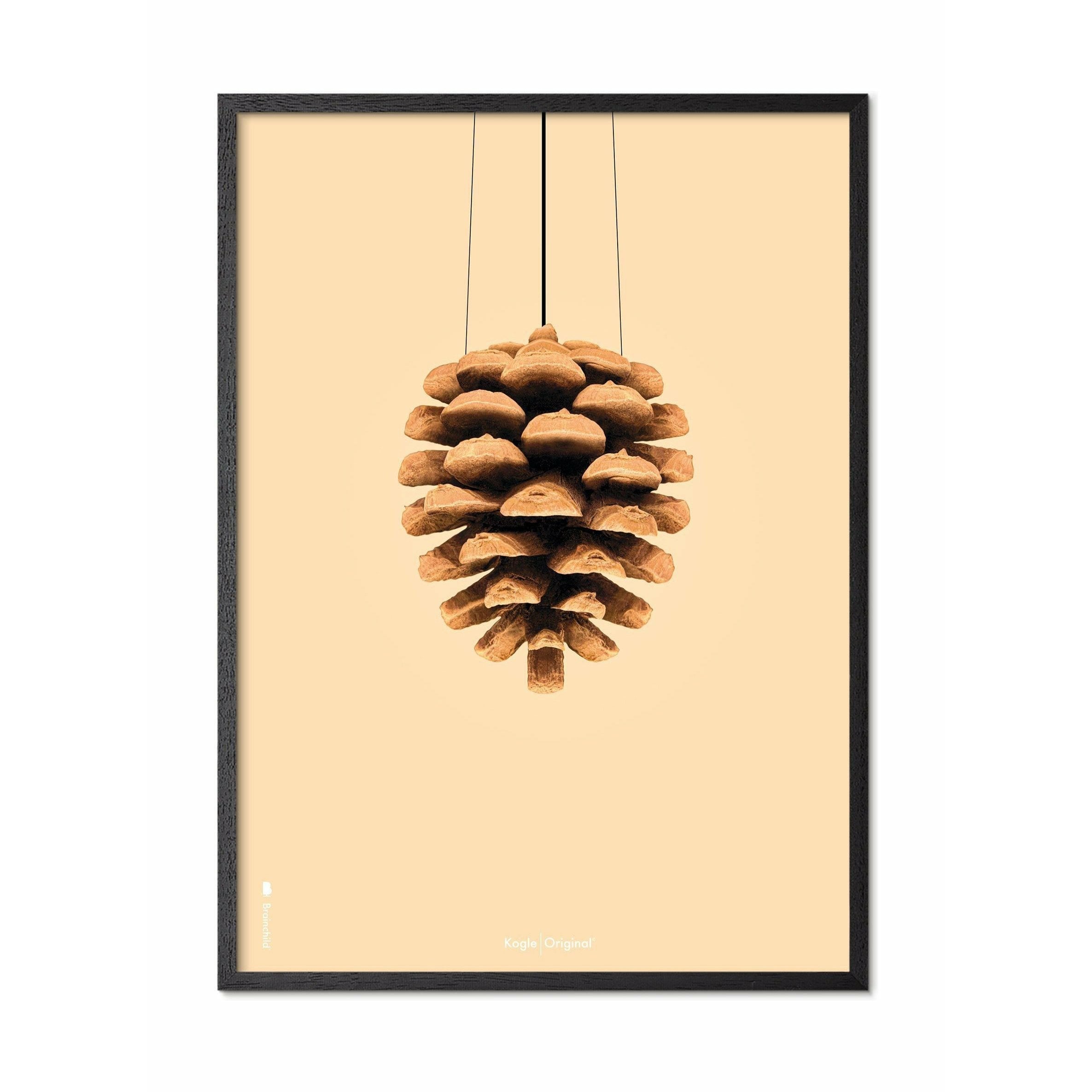 Poster classico di cono di pino da un'idea, cornice in legno laccato nero 50x70 cm, sfondo colorato di sabbia