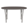 Fritz Hansen Superellipse餐桌棕色青铜/灰色Fenix层压板，135x90厘米