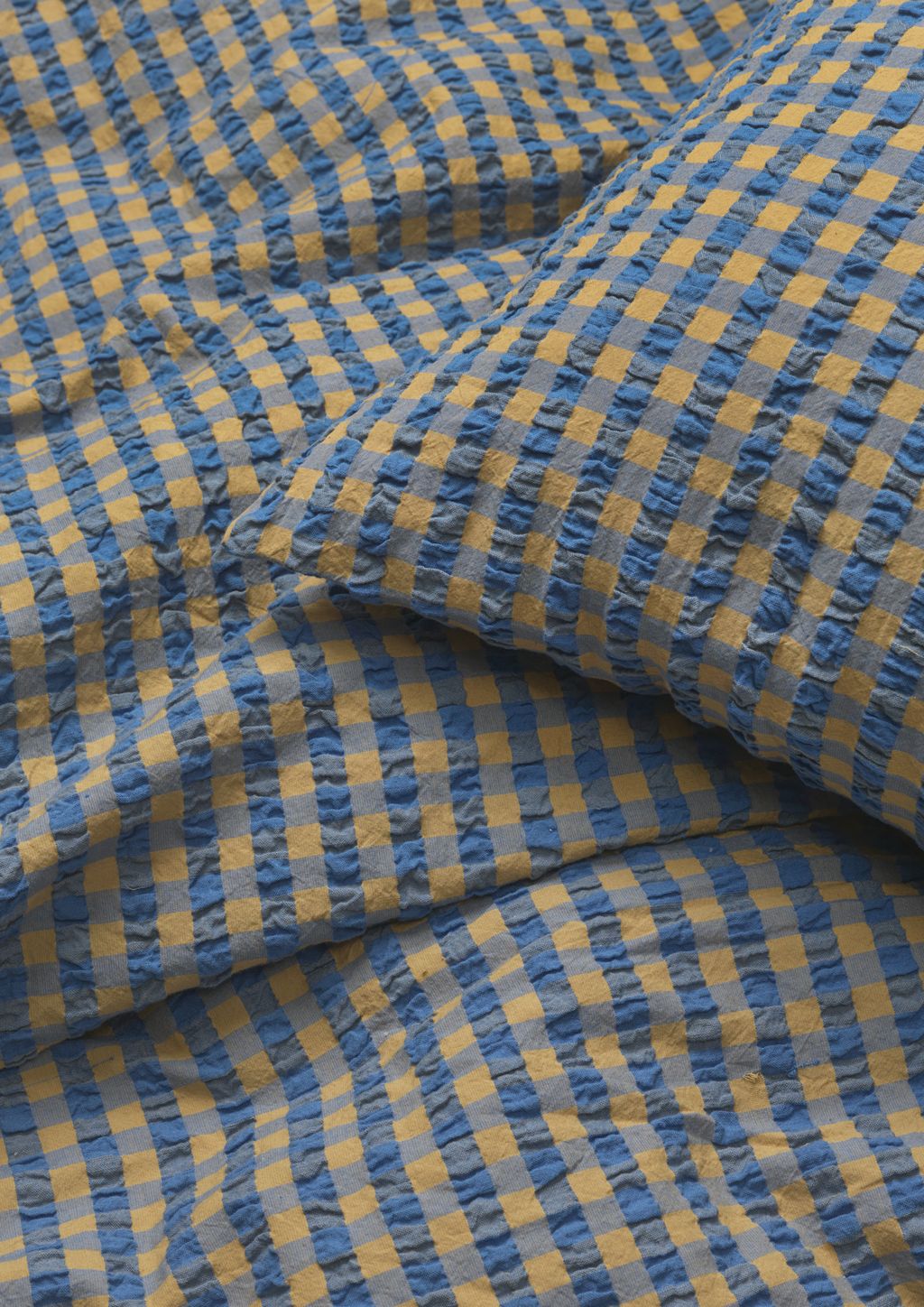 JUNA Bæk & Bølge sengelinned 140 x200 cm, blå/oker